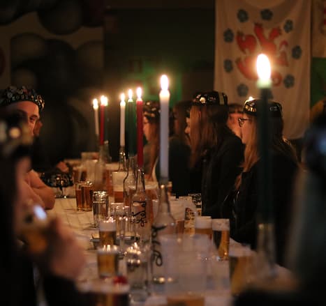 A candlelit pub gathering of the Eumavia